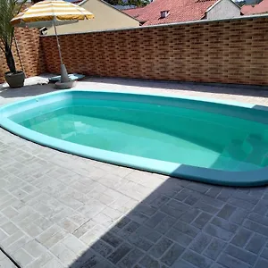 Quarto em Acomodações Particulares Casa Com Piscina